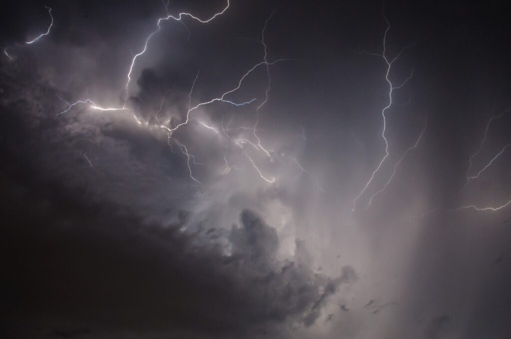 lightning through gray storm clouds